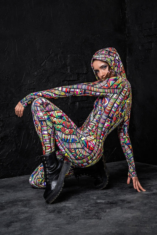 Model is crouched showing off a different side of the hippie knot Rave Onesie