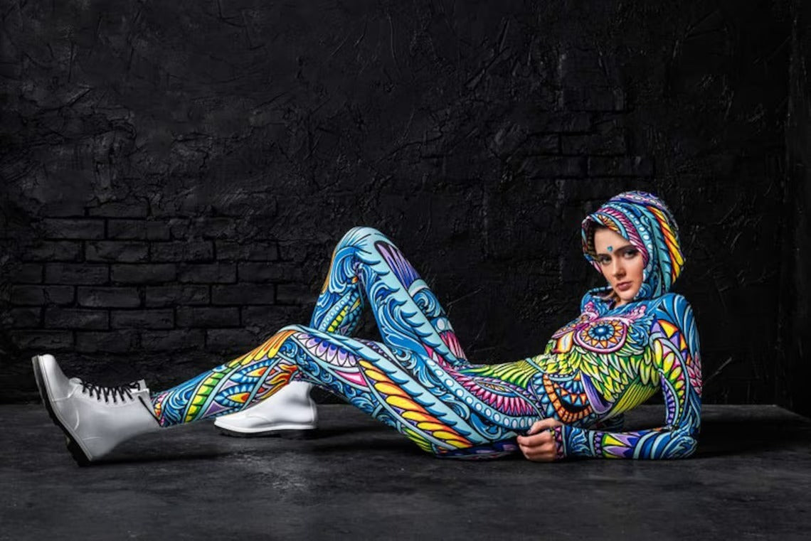 Different angle of the Cyan Birdy Fit Onesie with the model laying down 
