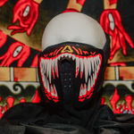 White Teeth Red Rave Mask in the light